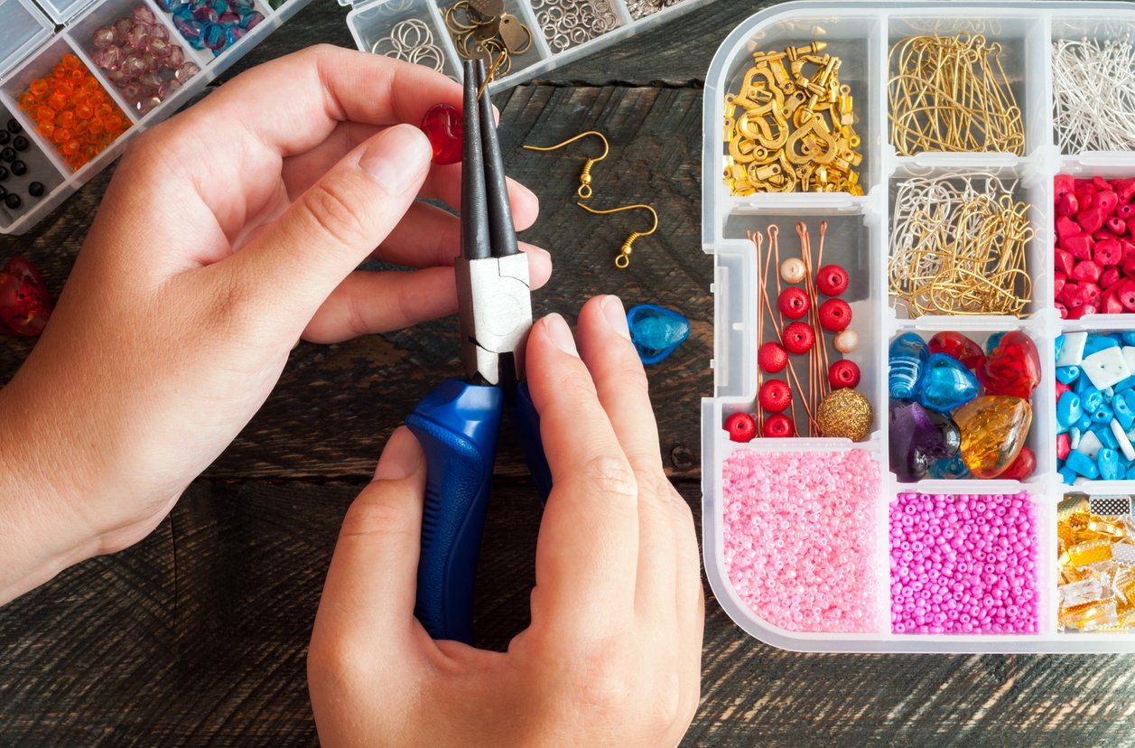 Making of handmade jewellery. Box with beads. Handmade accessories